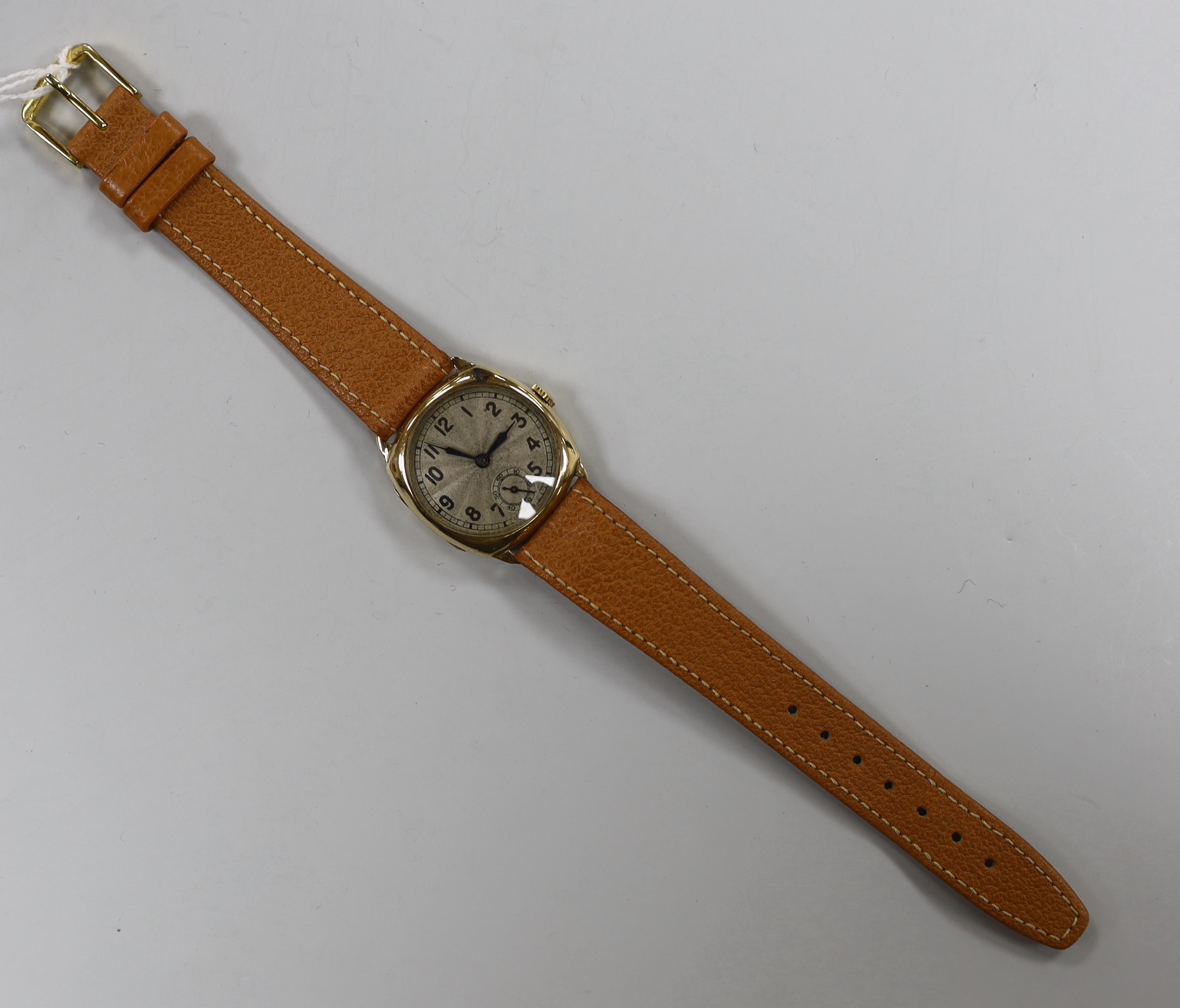A gentleman's 1930's? 9ct manual wind wrist watch, with Arabic dial, on a leather strap.